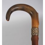 ANOTHER HORN HANDLED & KNARLED WOOD WALKING STICK, with an unusual embossed silver-metal collar, the