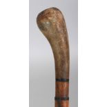 A HORN WALKING STICK, possibly partially rhinoceros horn, the shaft formed from graduated