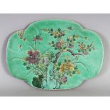 A GOOD QUALITY 19TH CENTURY CHINESE FAMILLE VERTE PORCELAIN PLAQUE, of quatrefoil form, the base