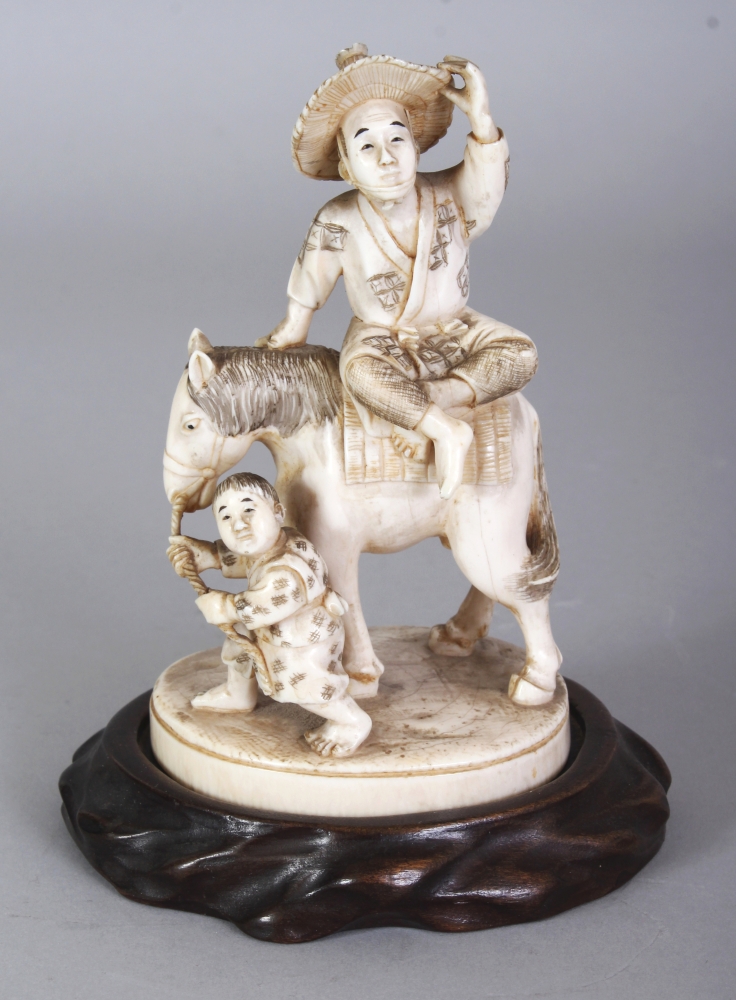 A GOOD QUALITY SIGNED JAPANESE MEIJI PERIOD IVORY OKIMONO OF A FARMER SEATED ON A HORSE, together