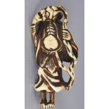 ANOTHER GOOD JAPANESE EDO PERIOD IVORY NETSUKE OF A STANDING SENNIN, clasping his beard and