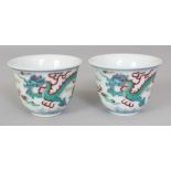 A PAIR OF CHINESE DOUCAI PORCELAIN DRAGON WINE CUPS, each base with a six-character Yongzheng