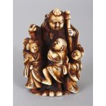 A GOOD QUALITY SIGNED JAPANESE MEIJI PERIOD STAINED IVORY NETSUKE, carved in the form of a