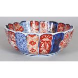 AN EARLY 20TH CENTURY JAPANESE IMARI FLUTED & LOBED PORCELAIN BOWL, 7.5in diameter & 2.8in high.