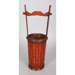 AN EARLY 20TH CENTURY SIGNED JAPANESE BAMBOO WOVEN MODEL OF AN UCHIMIZU BUCKET, the base with an