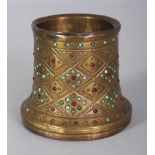 A SMALL EASTERN STONE INSET BRASS POT, 2.8in diameter at base & 2.5in high.