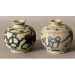 A SIMILAR PAIR OF CHINESE WANLI PERIOD SHIPWRECK BLUE & WHITE PORCELAIN JARS. (from the collection