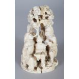 A JAPANESE MEIJI PERIOD IVORY OKIMONO OF THREE DEITIES AND A BOY ATTENDANT IN A PINE GROVE, 3.6in