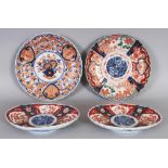 A GROUP OF FOUR EARLY 20TH CENTURY JAPANESE IMARI PORCELAIN PLATES AND OVAL DISHES, the largest