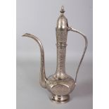 A 20TH CENTURY INDIAN SILVER-METAL EWER, with a hinged cover, 12.6in high.