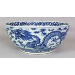 A GOOD LARGE 19TH CENTURY CHINESE BLUE & WHITE PORCELAIN DRAGON BOWL, the base with a six-