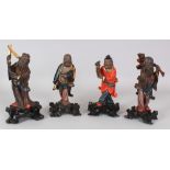 A GROUP OF FOUR EARLY 20TH CENTURY CHINESE LACQUERED WOOD IMMORTALS, each base with a Niong Hing