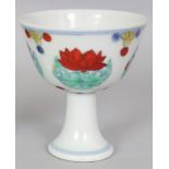 A CHINESE MING STYLE DOUCAI PORCELAIN STEM CUP, the base with an extended six-character Chenghua