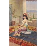 Attributed to Eugene Ansen Hofmann (19th-20th Century) Austrian. A Reclining Oriental Girl Playing