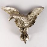 A CHROME CAR MASCOT, AN EAGLE with outstretched wings.