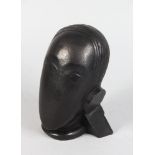 AFTER GUSTAVE MIKLOS (1888-1967) HUNGARIAN A SMALL BRONZE ABSTRACT BUST, signed G. MIKLOS. 6.5ins