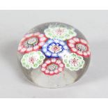 A MILLEFIORI PAPERWEIGHT. 2.5ins diameter.