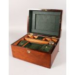 A VICTORIAN ROSEWOOD VANITY BOX with mother-of-pearl oval, partly fitted interior. 12ins long.