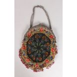 A SILVER MOUNTED BEAD WORK EVENING BAG.
