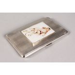 AN ENGINE TURNED CIGARETTE CASE, 5.5ins x 3.25ins, Birmingham 1953, the cover with a glamour oval.