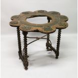 AN 18TH CENTURY BRAZIER STAND on four barley twist legs and metal uniting brackets. 3ft 1ins