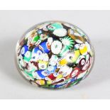 A MILLEFIORI PAPERWEIGHT. 3ins diameter.