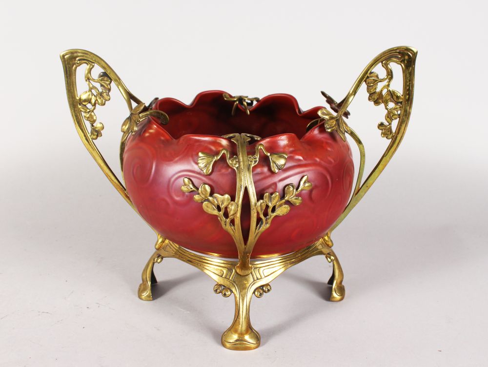 A SUPERB ART NOUVEAU IRIDESCENT GLASS BOWL, in a gilt metal stand in the manner of LOETZ, the shaped