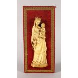 A VERY GOOD 18TH CENTURY EUROPEAN CARVED IVORY MADONNA AND CHILD. 7.5ins long, in a velvet frame.