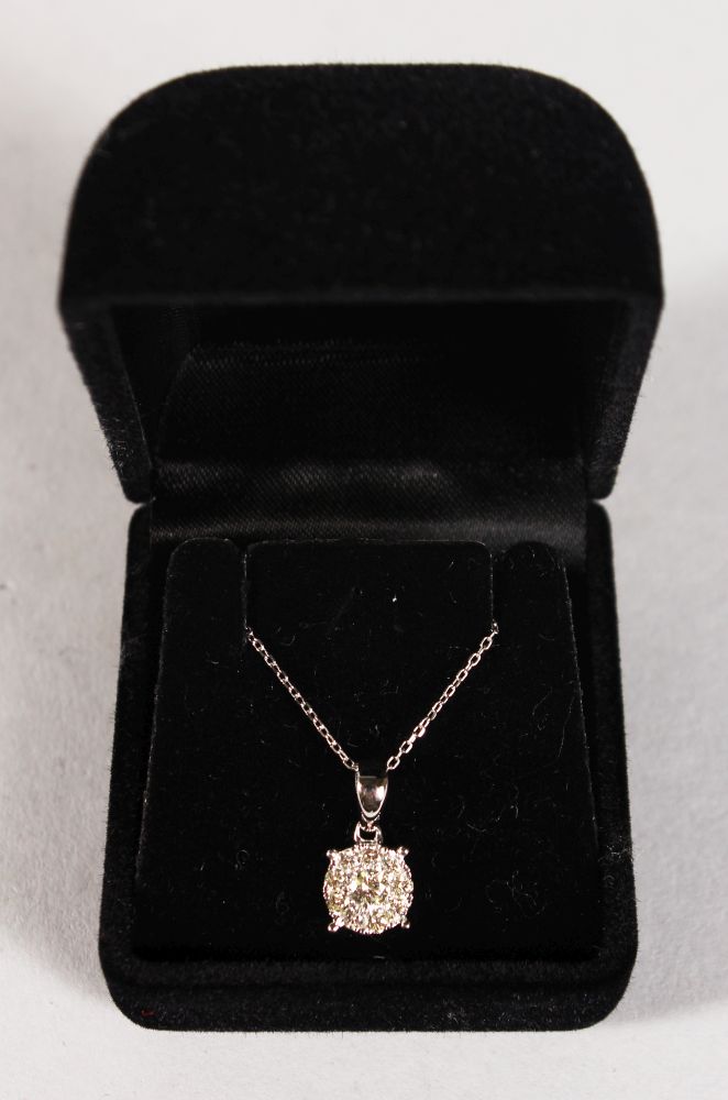 A GOOD 9CT GOLD DIAMOND CLUSTER PENDANT AND CHAIN.