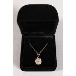 A GOOD 9CT GOLD DIAMOND CLUSTER PENDANT AND CHAIN.