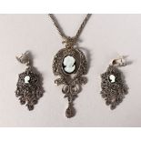 A SILVER MARCASITE CAMEO NECKLACE AND EARRINGS.