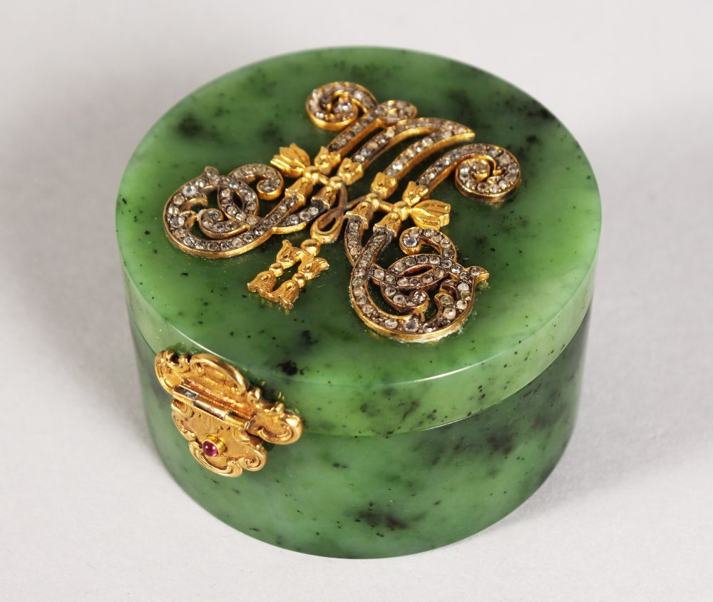 A RARE RUSSIAN FABERGE STYLE GREEN JADE CIRCULAR BOX AND COVER with diamond set gold initials. 2.