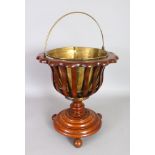 A 19TH CENTURY DUTCH MAHOGANY JARDINIERE, with brass liner, slatted sides on a circular base. 1ft