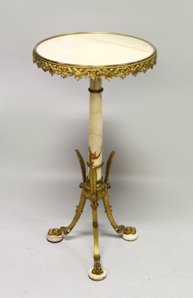 A 19TH CENTURY FRENCH ORMOLU AND MARBLE GUERIDON, the circular top with ornate cast frieze on a