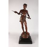 J. CAMBOS A LARGE STANDING BRONZE OF A NUBIAN MAN HOLDING A SWORD. Signed, with presentation label