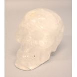 A CARVED ROCK CRYSTAL HUMAN SKULL. 5ins high.