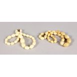 TWO STRINGS OF IVORY BEADS.