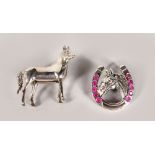 TWO SILVER HORSE BROOCHES.