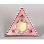 A RARE RUSSIAN FABERGE STYLE PINK ENAMEL TRIANGULAR FRAME, set with seed pearls and cabochon