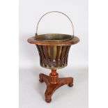 A 19TH CENTURY DUTCH MAHOGANY JARDINIERE, with brass liner, slatted sides on a concave sided base.