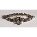 A CAUCASIAN SILVER AND NIELLO DECORATED BELT, with a dagger shaped clasp. 24ins long.