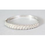 A SUPERB 18CT WHITE GOLD AND DIAMOND BANGLE.