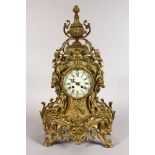 A LATE 19TH CENTURY FRENCH ROCOCO REVIVAL ORMOLU MANTLE CLOCK, with enamel dial, Roman numerals