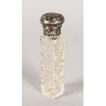 A CUT GLASS SCENT BOTTLE with silver top with key pattern engraving. 3.25ins.