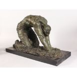 AN UNUSUAL ABSTRACT BRONZE FIGURE OF A KNEELING MAN, on a rectangular marble base. 2ft 1ins long.