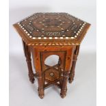 AN ISLAMIC OCTAGONAL INLAID TABLE with calligraphy. 19ins high, 13ins long.