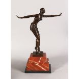 AN ART DECO STYLE BRONZE OF A DANCING LADY, on a rectangular marble base. 1ft 7ins high.