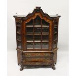 A GOOD 18TH CENTURY DUTCH MINIATURE VITRINE, with shaped top, glass door and sides, enclosing
