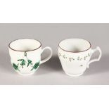AN 18TH CENTURY BRISTOL COFFEE CUP with rare handle painted with a chain of trailing flowers and a