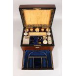 A VICTORIAN ROSEWOOD VANITY BOX with mother-of-pearl oval, fitted interior, twelve plated top